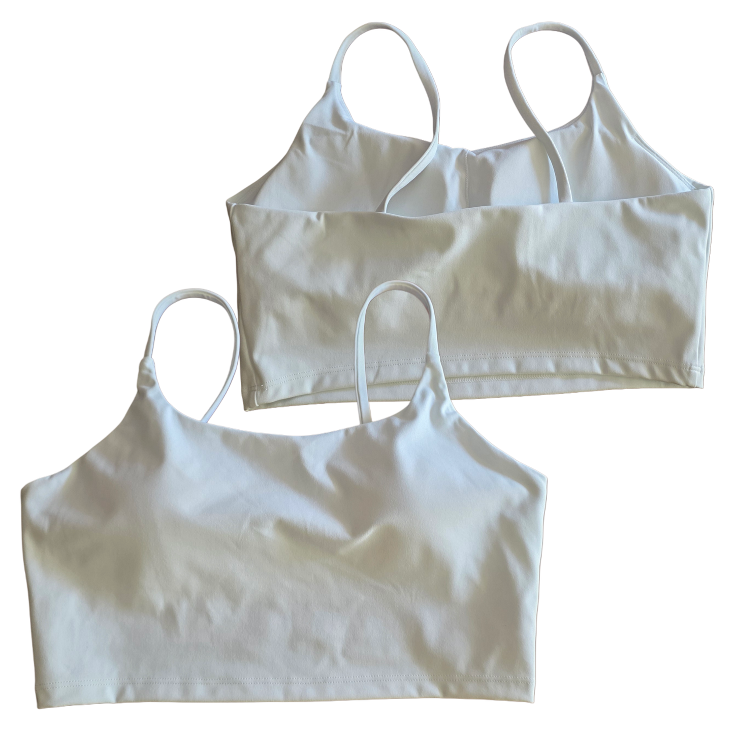 Two white crop tops on a white background
