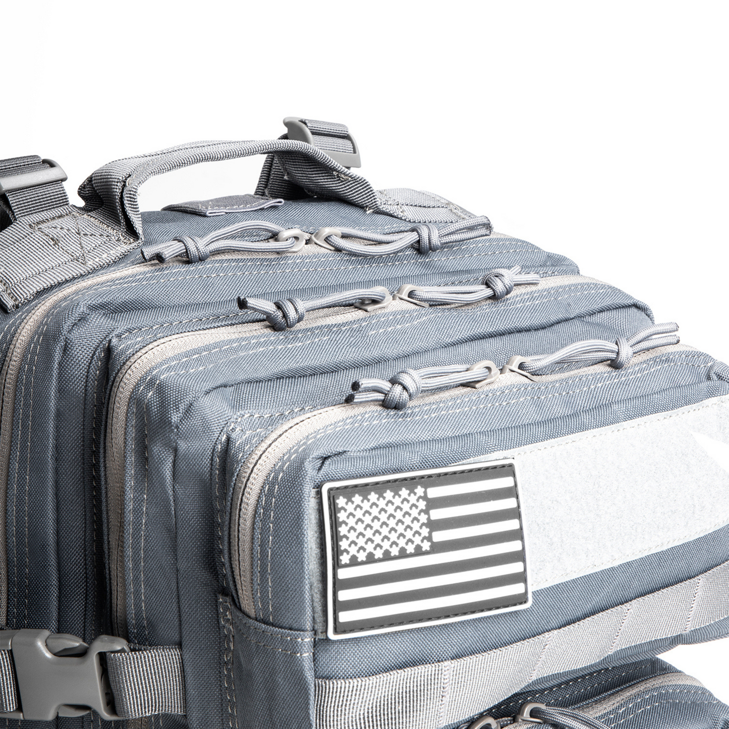 Gray tactical backpack with American flag patch on a white background