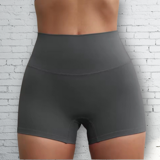 A pair of high-waisted, graphite gray workout shorts with a 3-inch inseam.