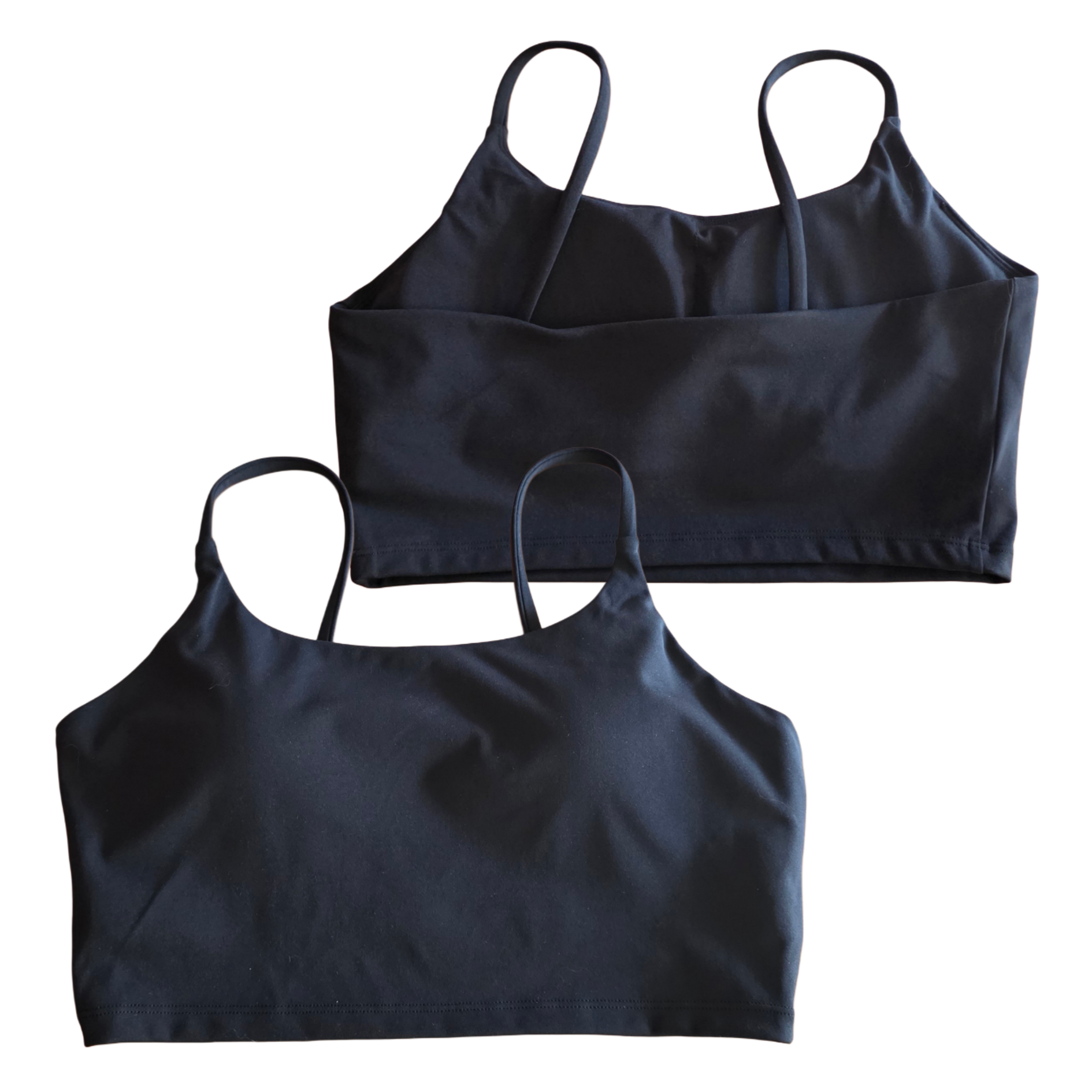 Two black crop tops on a white background
