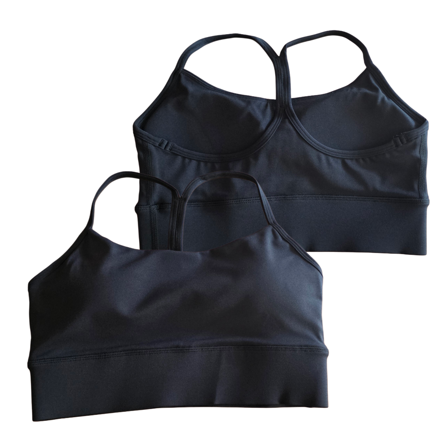 Two black crop tops on a white background
