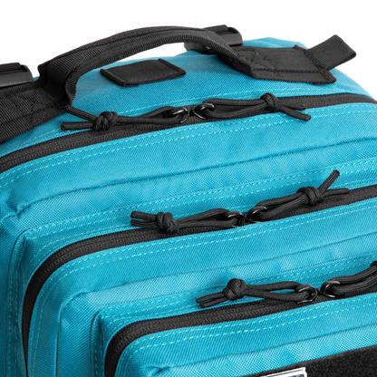 Close-up of a blue bag with black zippers and straps on a white background