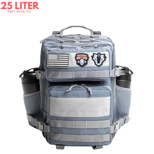 Gray tactical backpack with patches on a white background