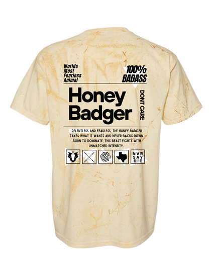 Beige tie-dye t-shirt with text and graphics on a white background